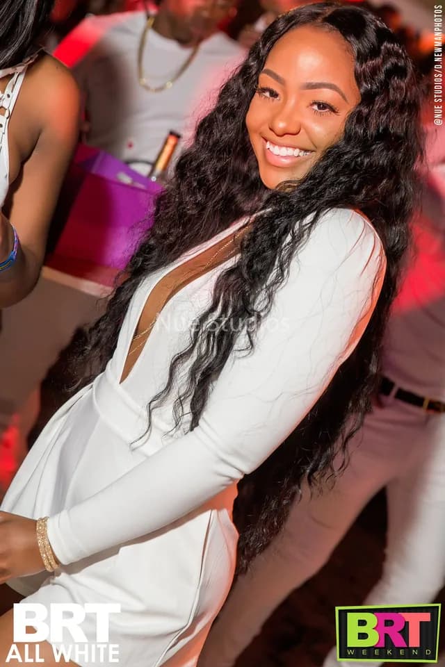 Guest smiling at the BRT All White party