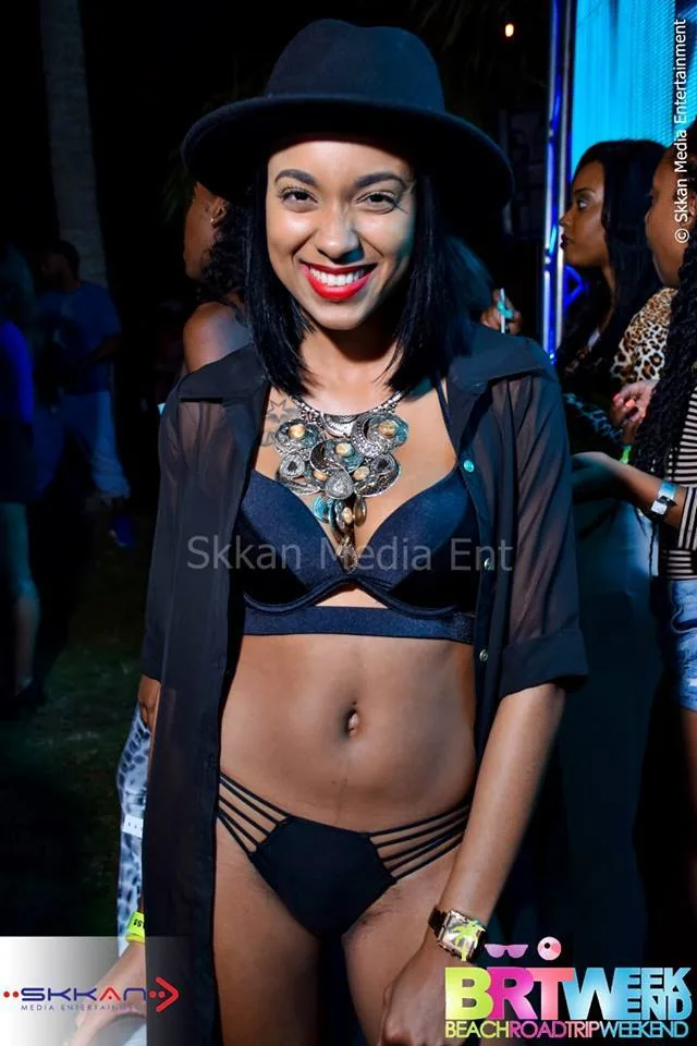 Guest in black at a nighttime BRT Weekend event
