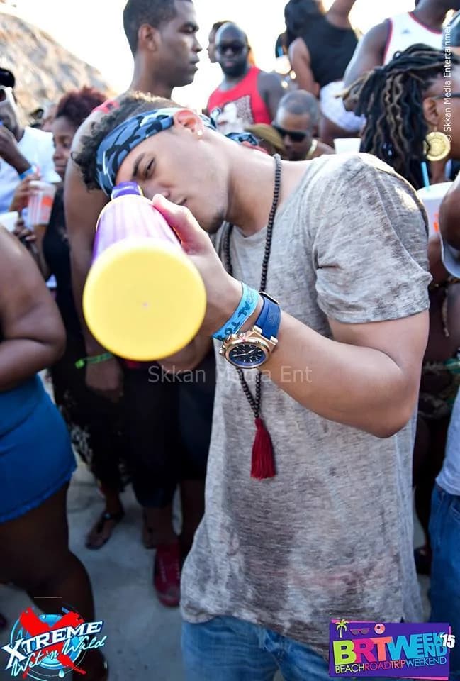 Jouvert guest joining the celebration with a horn